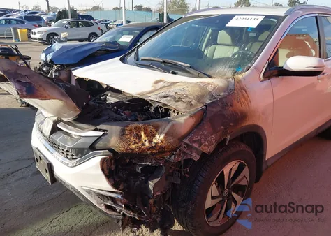 2016 Honda Cr-V Touring z USA, uszkodzony, nr VIN 5J6RM4H93GL109044